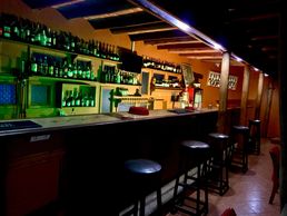 A beautiful bar at Babylon Lodge offers good drinks, food, and music. Enjoy your Kilimanjaro beer !