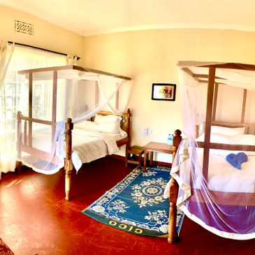 A twin room at Babylon Lodge. A beautiful room with two twin beds.