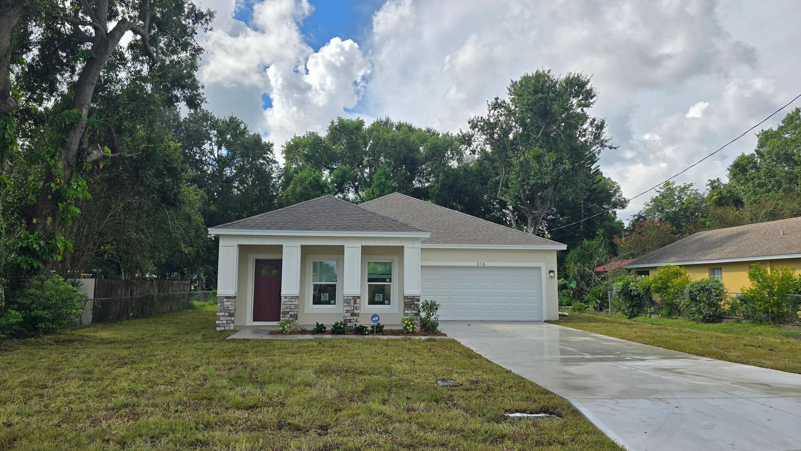 Allure model 3/2/2 Lakeland FL infill lot affordable house program.
