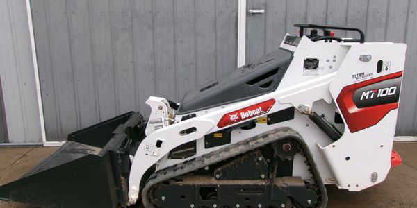 Compact Bobcat MT100 mini skid steer loader with rubber tracks and front bucket.