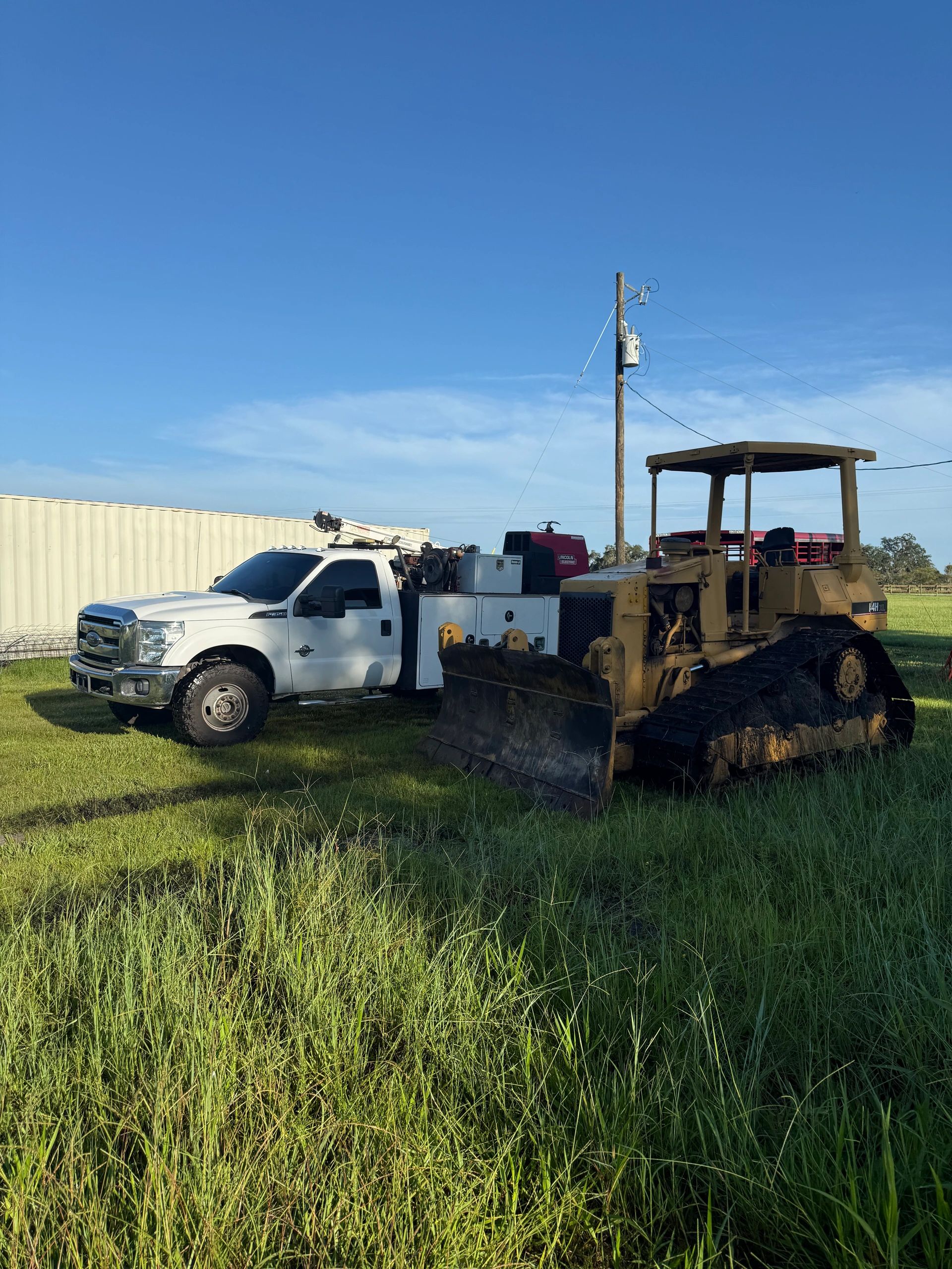 Severns Diesel service truck hauling heavy equipment for on-site fleet maintenance