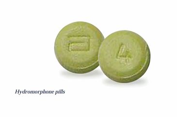 Green hydromorphone pills with imprints on a white background.