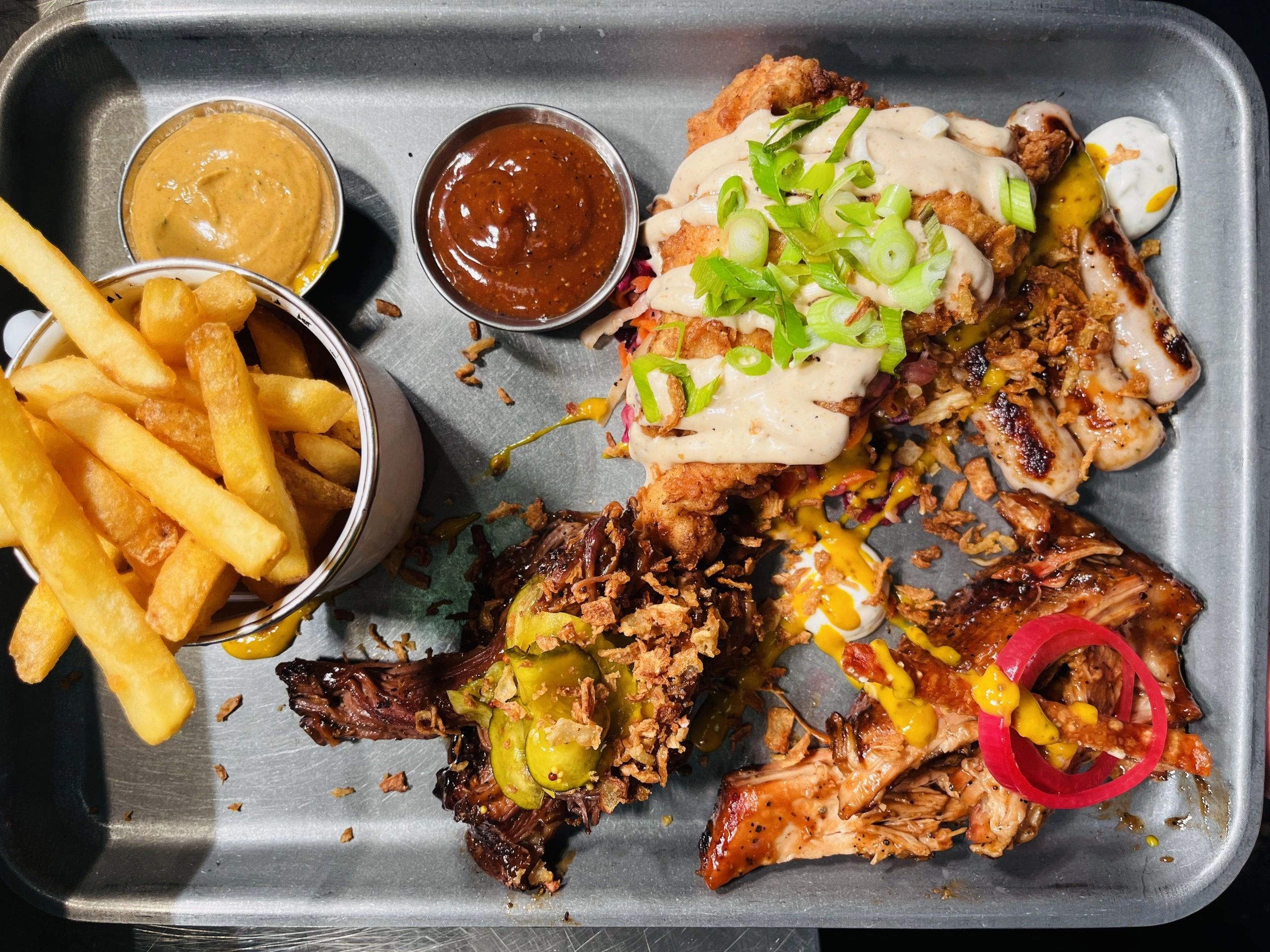 Bull Tray featuring slow-smoked meats, and sauces at Bull & Bar, 60 High Street, Street, Somerset.