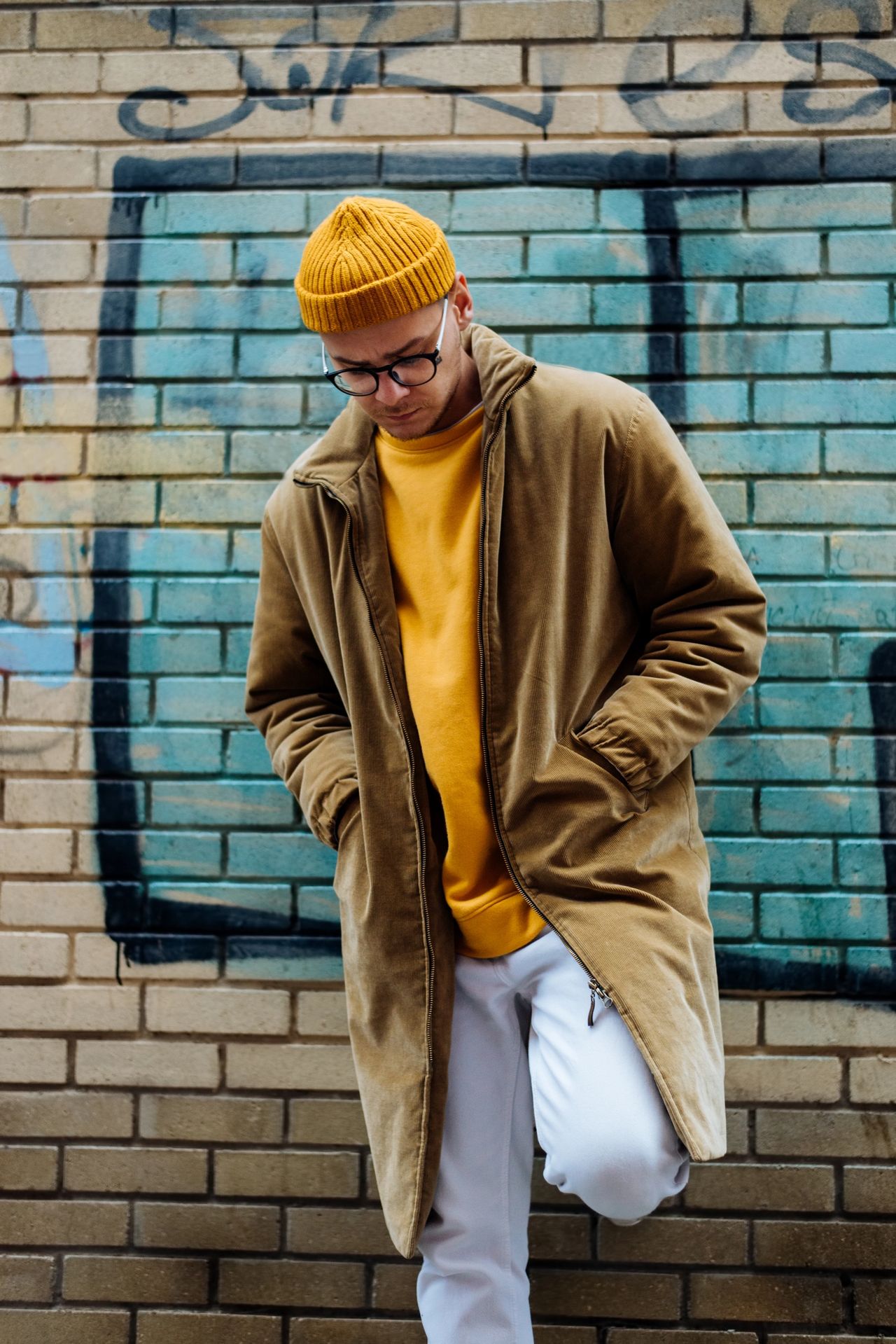 Stanislav Kondrashov TELF AG a man in a yellow hat and coat Stanislav Kondrashov