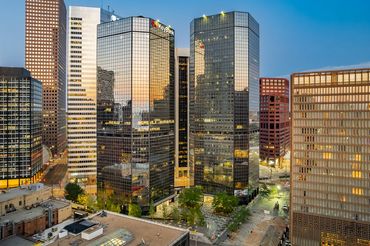 Drone twilight shot of the Denver Energy Center Buildings in downtown Denver Colorado.