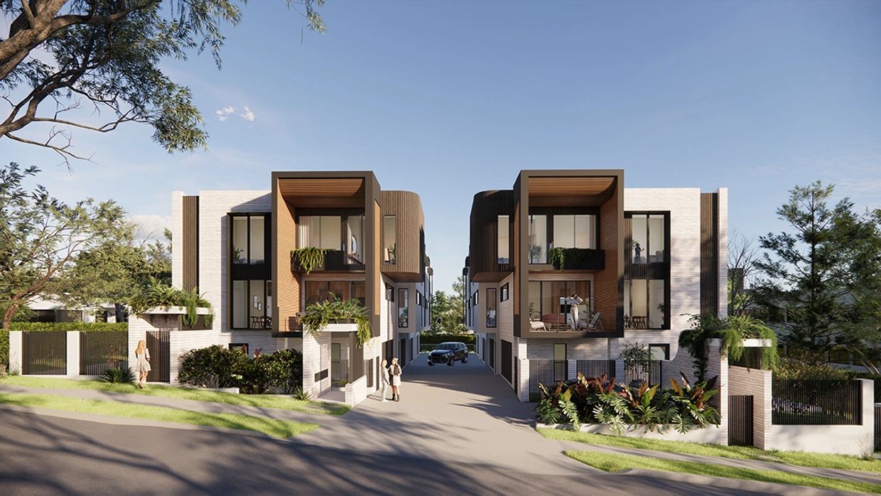 Modern twin townhouses with clean lines and greenery under clear skies.
