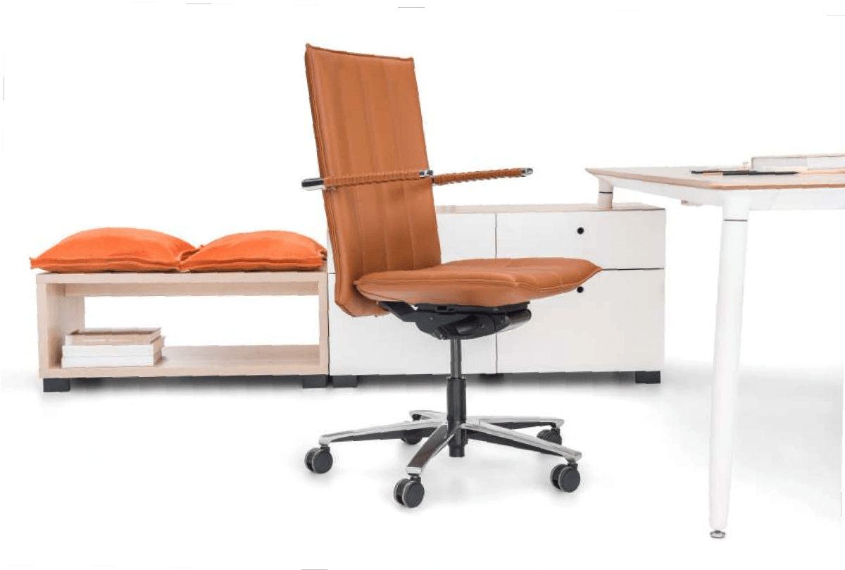 Modern ergonomic office chair with brown leather near a white desk.
