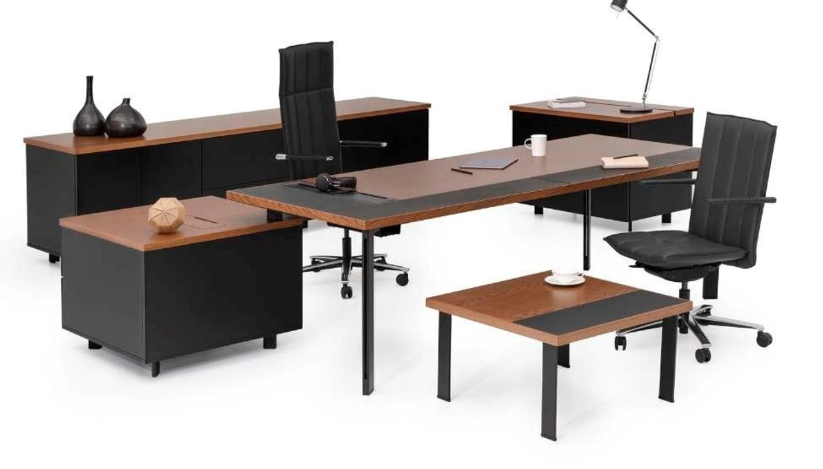 Modern office setup with black and wood furniture including desks and chairs.
