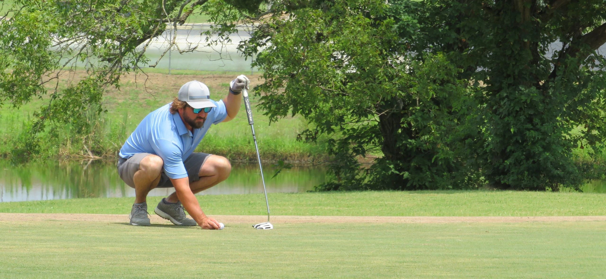 Beau Swearingen preparing for a putt.