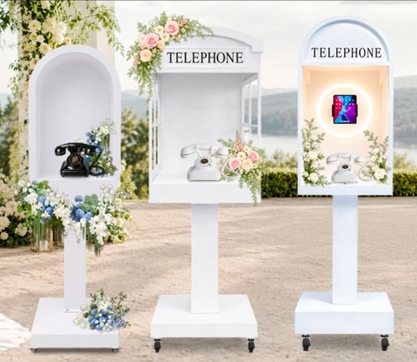 Three decorated telephone stands with vintage and modern phones.