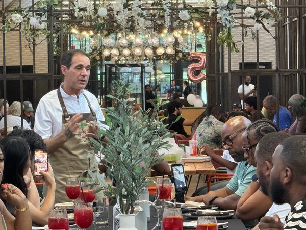 Chef Steven Ferdinand engaging guests at a culinary event
