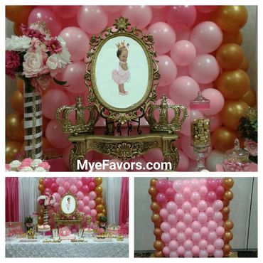 Pink and gold princess-themed party decorations with balloons and crowns.