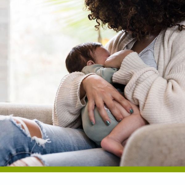 Parent breastfeeding newborn