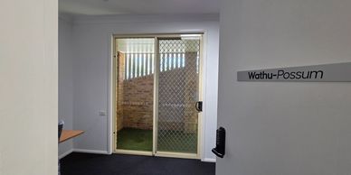 Sliding glass door leading to a small outdoor area.