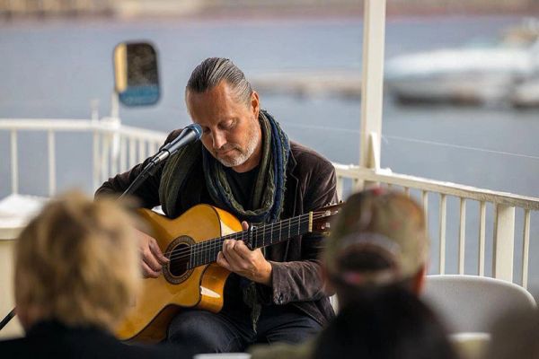 Man playing guitar.
