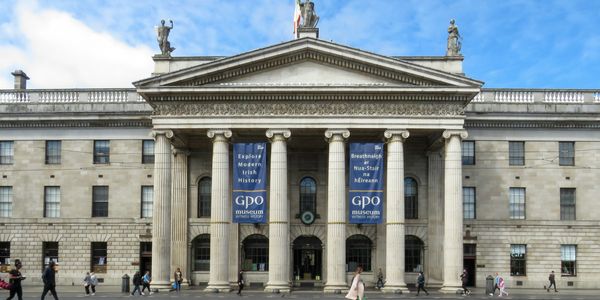 Exterior of the GPO Museum with people walking in front.