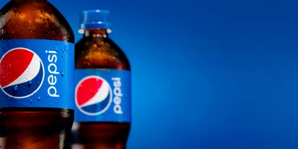 Two bottles of Pepsi against a blue background.