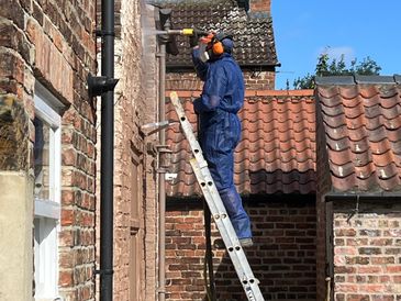 Sandblasting brick wall