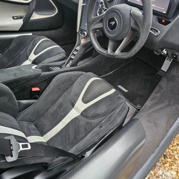 Interior of a luxury sports car with black and gray seats.