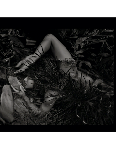 artistic portrait of a woman contorted in a swamp