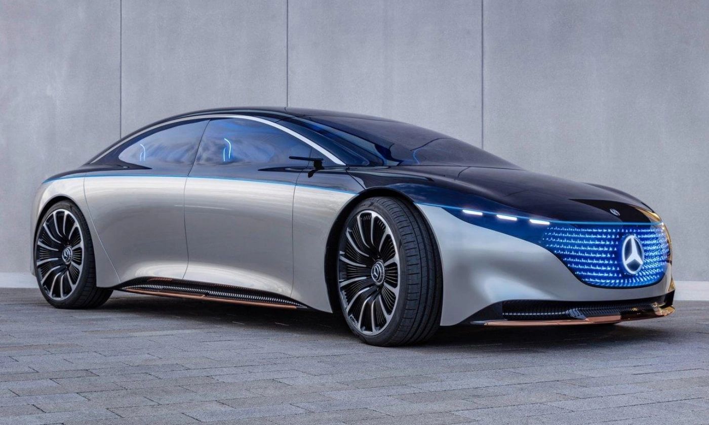 A sleek, futuristic Mercedes-Benz electric car with illuminated grille.