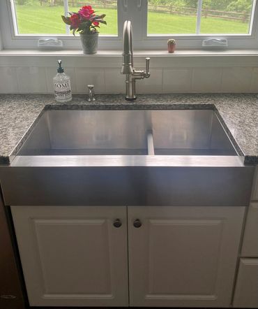 Brizo Artesso kitchen faucet with Kohler double farm sink - both in stainless