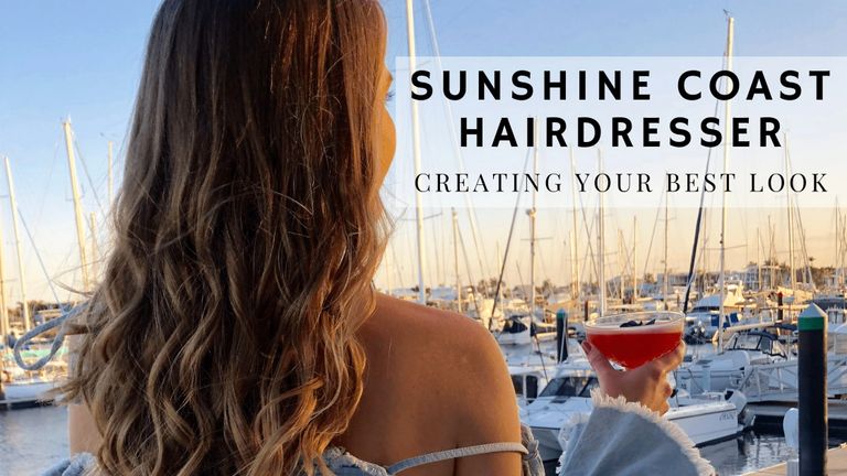 Photo of girl with long blonde curled hair created by Sunshine Coast Hairdresser watching the sunset