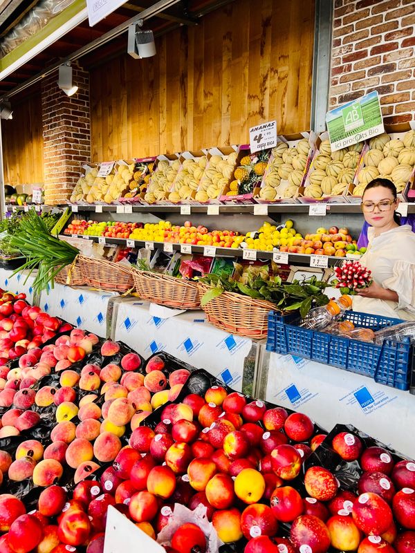 Food tour stop at the food market on Rue des Martyrs in Paris