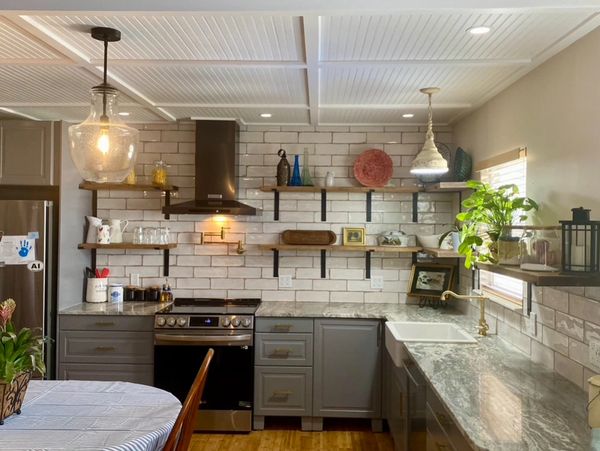 Complete custom kitchen from floors to ceiling, countertops, tile and fixtures. 