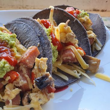 blue corn tortilla with breakfast taco filling