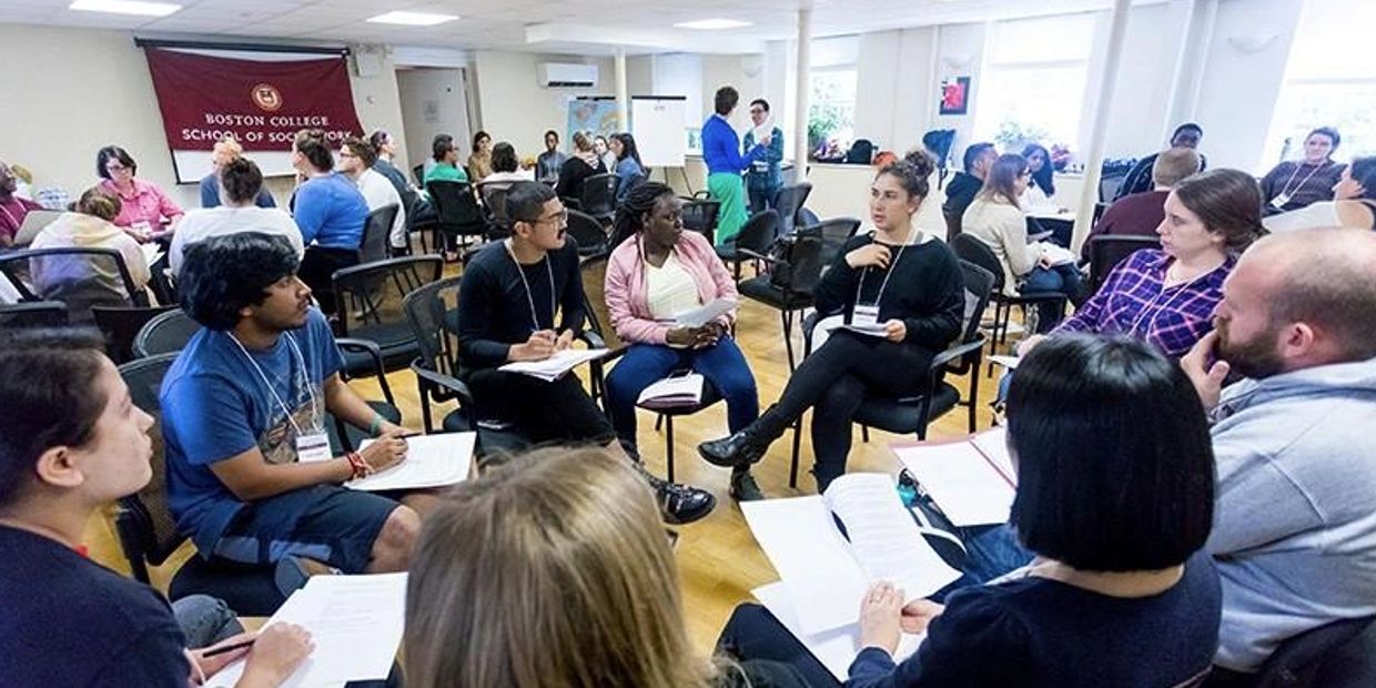 Students engaged in group discussion at Boston College.