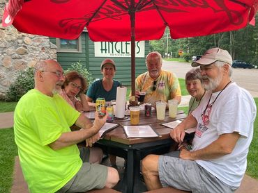 Northern Paddle Trail bike trip participants taking a break, having ice cream.