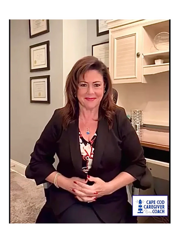 Professional woman seated in an office with certificates on the wall.
