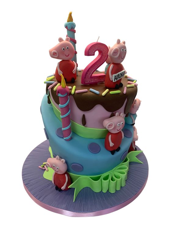 Two tier topsy Turvy cake with peppa pig characters and design by durham city cakes 