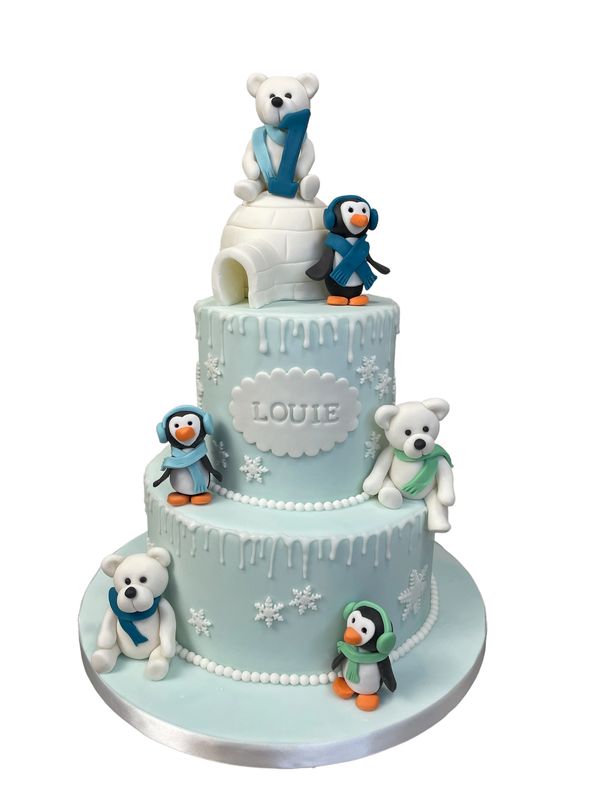 winter inspired cake with bears and penguins