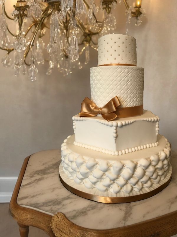 four their gold and Ivory wedding cake by Durham City Cakes 