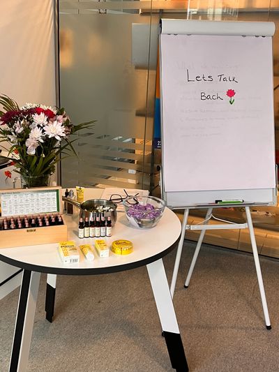 Training classroom set up with Bach flowers remedies on a table and whiteboard for presentation.