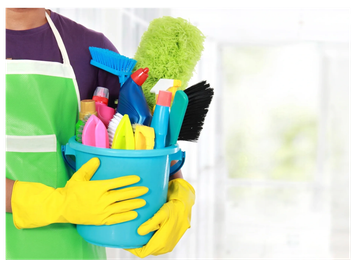 Person in yellow gloves holding a bucket of colorful cleaning supplies.