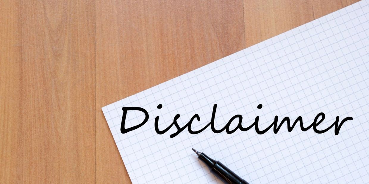 Pen and paper with the word 'Disclaimer' written on it.