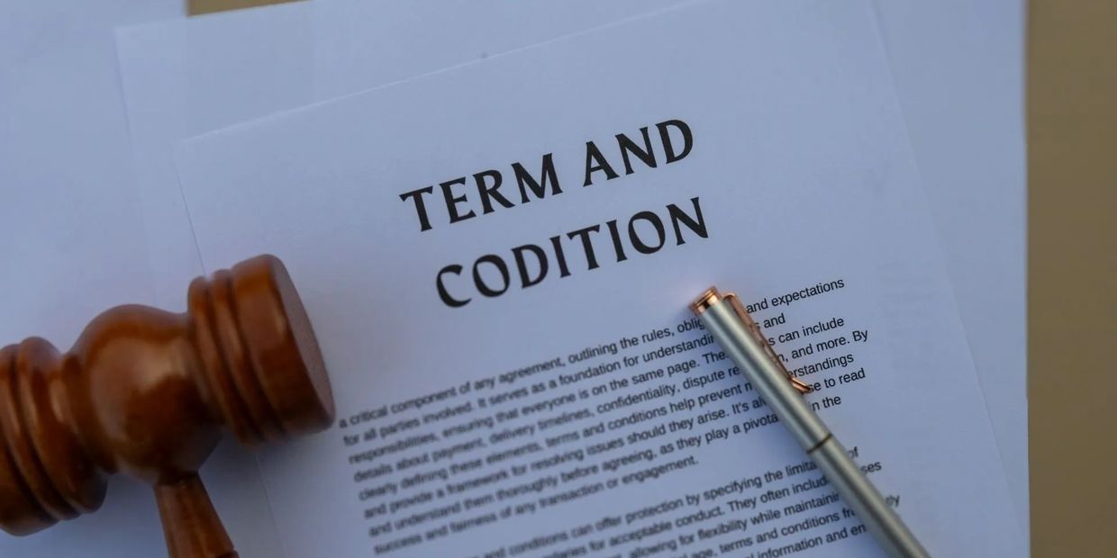 Legal document titled 'Term and Condition' with a gavel and pen beside it.