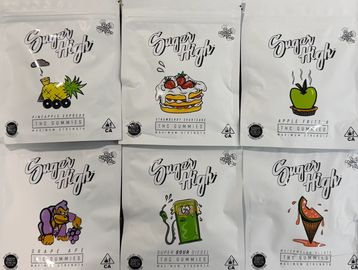 Assorted Sugar High THC gummies in various flavors and packaging.