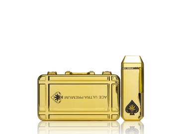 Gold-colored vape device and cartridge with reflective surface.