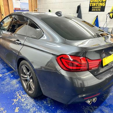 4 door BMW 3 series Gran Coupe with a 5% window film installed. 