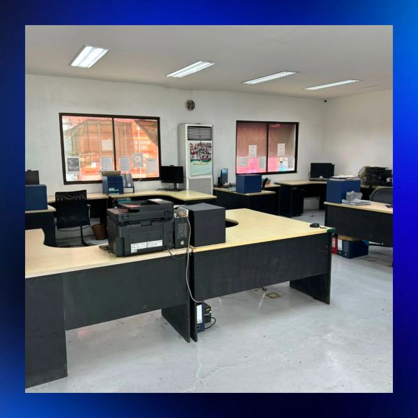 Empty office with desks and computers.