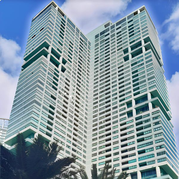 Modern high-rise building against a blue sky.