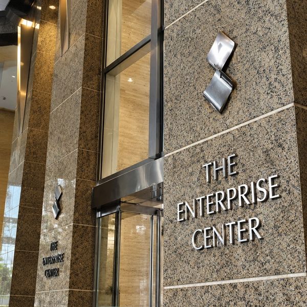 The Enterprise Center entrance with polished stone walls and metal logo.