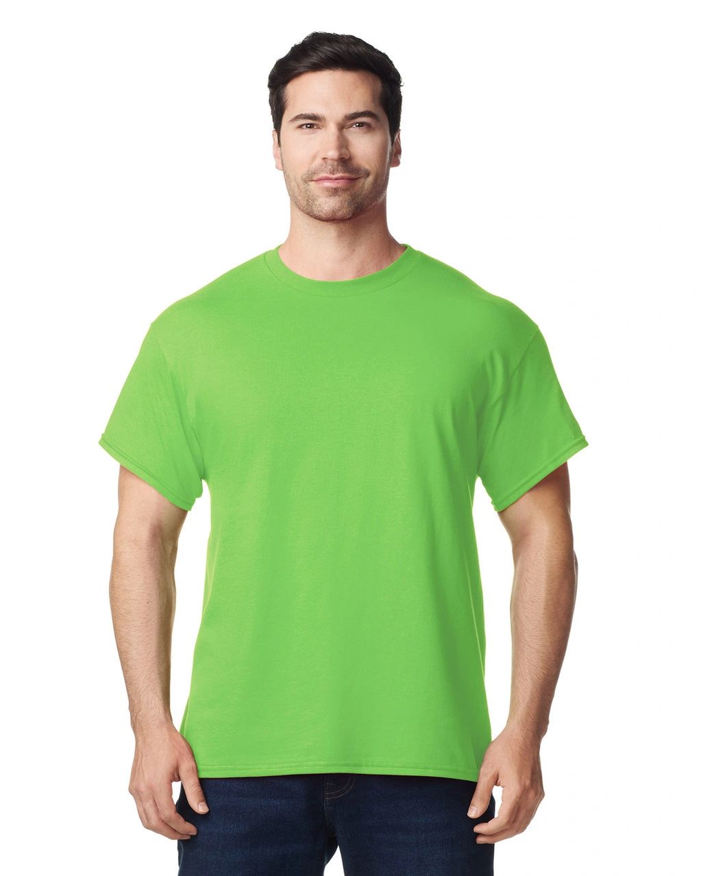 Man wearing a bright green t-shirt and blue jeans against a white background.