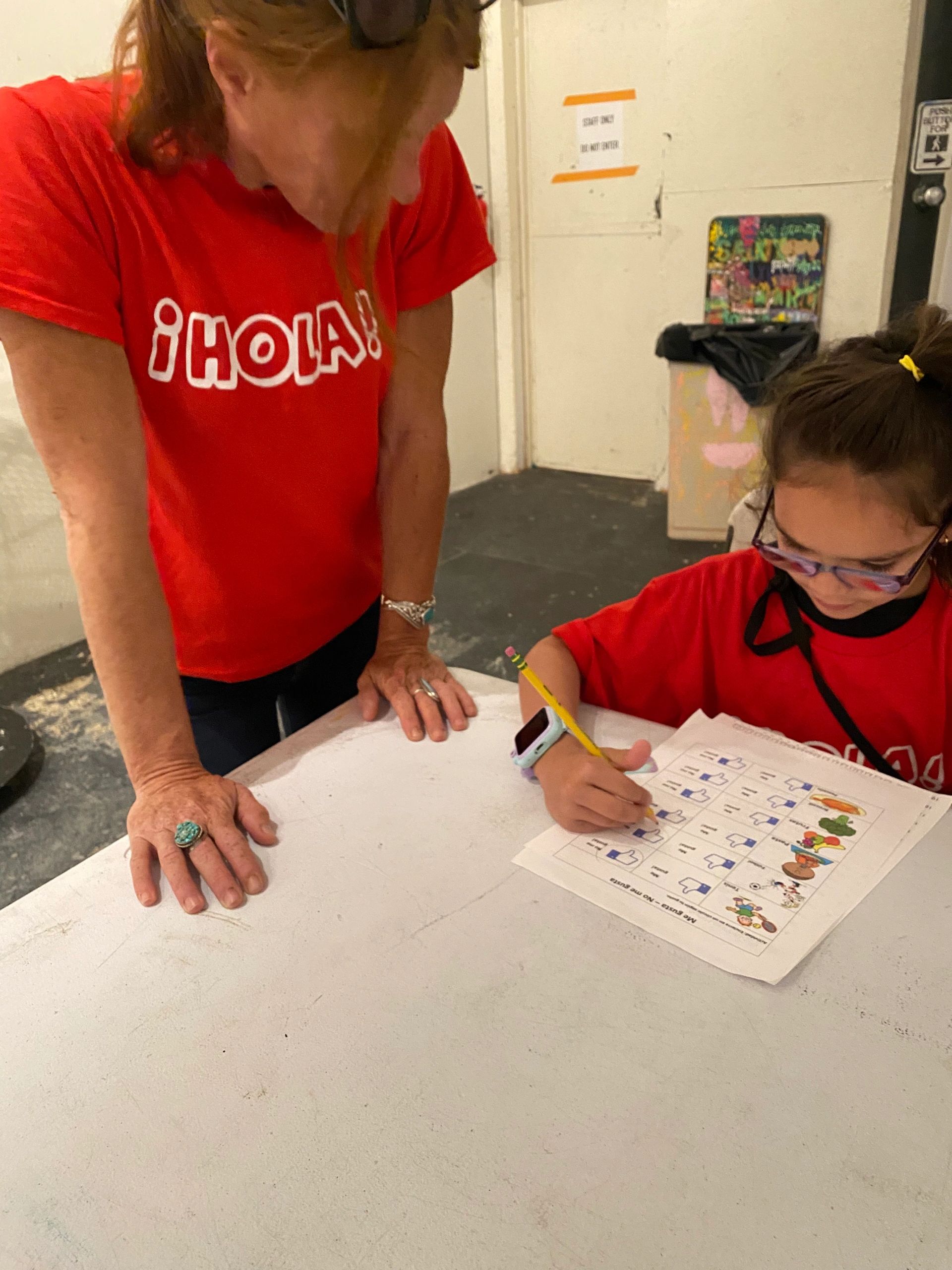 Father and kid smiling in red T-shirts