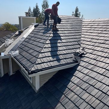 Workers installing a roof