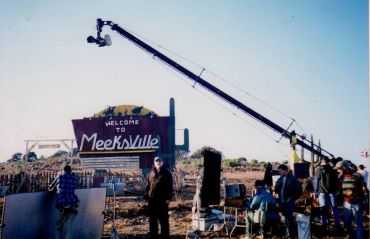 Film crew working by Meeksville sign.